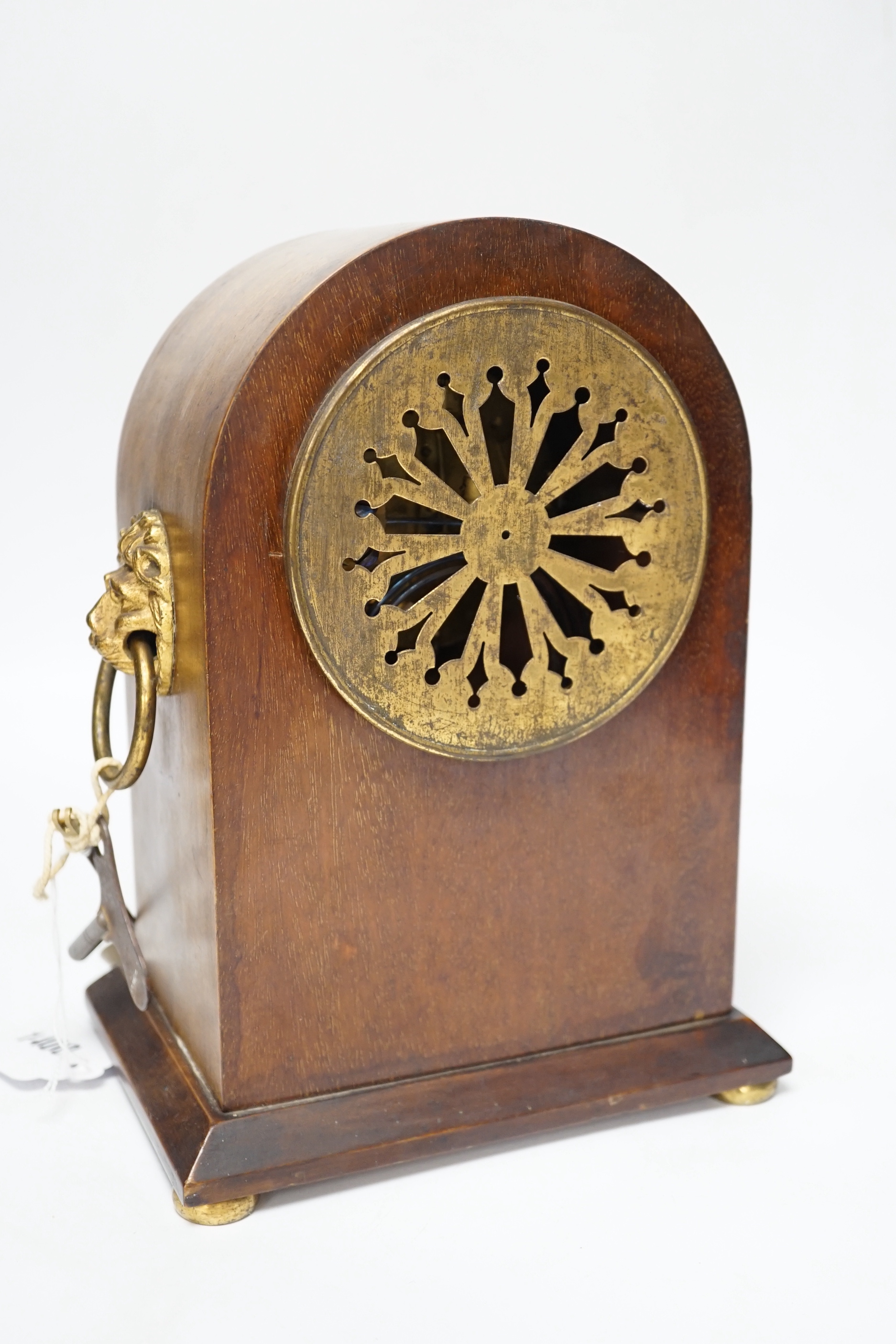 An Edwardian mahogany mantel clock, French movement striking on a coiled gong, 25cm high